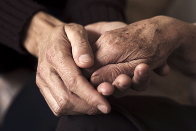Two hands intertwined.