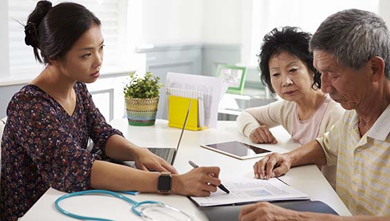 Older couple meeting with doctor