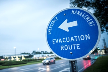 sign pointing toward evacuation route