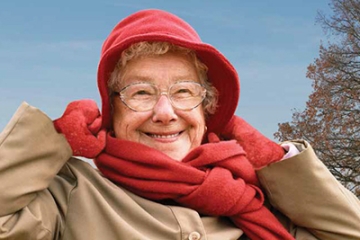 Older woman bundled up in layers during winter