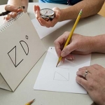 Close up of health professional administering a cognitive impairment test