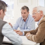 three older men talking