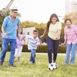 Family playing soccer