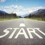 Road with the word start and an arrow painted on the road.