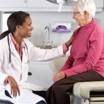 health care professional smiling with older patient